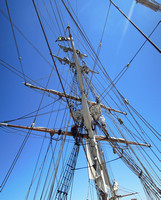 Crew aloft to set sail on the fore