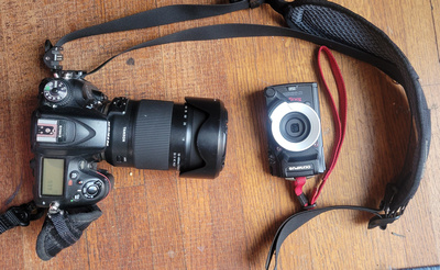 Nikon D7100 with Tamron 18-400 lens and Olympus TG5